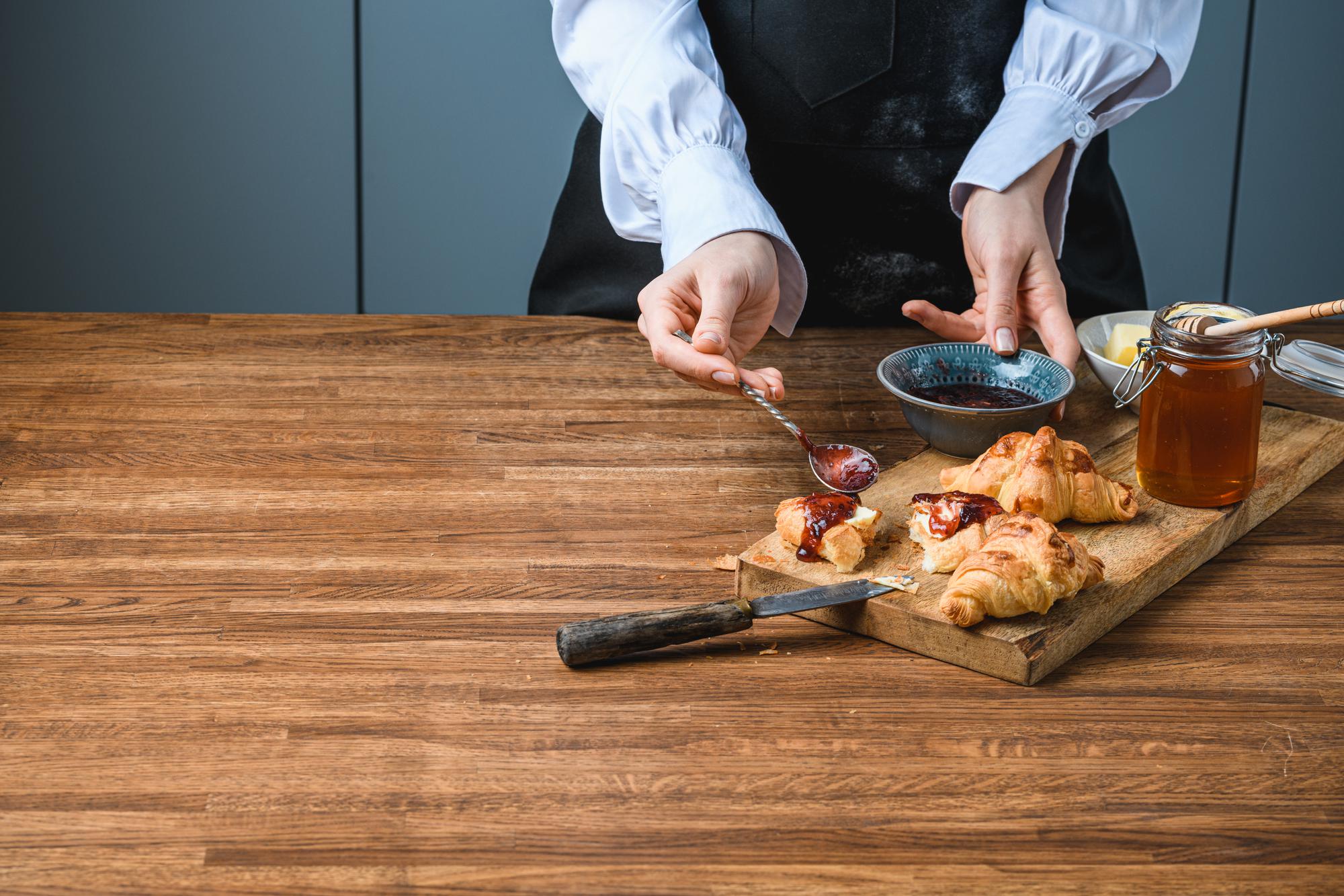 Chef preparing mise en place on wooden table